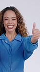 Thumbs up, happy and face of woman in studio for positive vote, agreement or opinion with emoji. Smile, portrait and person with hand gesture for approval, satisfaction or yes by white background.