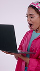 Surprise, woman and excited with laptop in studio for college admission, merit award or pride. Celebration, student or fist pump with tech on white background for honor roll, scholarship grant or win