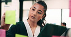 Woman, writing and sticky note with tablet in office for insight, glass and review at finance agency. Person, broker and planning with tech, app or problem solving with asset management at company