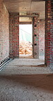 Brick wall, building and construction with sand on worksite for property or real estate development. Architecture, design and engineering with dirt outdoor for industry, infrastructure or project