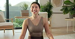 Face, woman and happy with yoga in home for holistic practice, exercise rest and self care. Yogi, asian person and relax with portrait in living room for fitness break, morning wellness and health