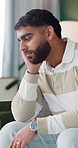 Mental health, man and thinking in house with regret, bad memory and tension with worry for mistake. Living room, lonely and person with depression for decision, pensive and reflection with anxiety