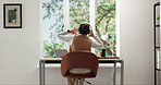 Back, woman and dance with headphones for remote work, streaming music and online for creative career. Window, person and audio tech in home with freelance job, good mood and rhythm for radio song.
