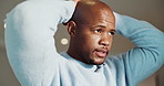 Serious, thinking and black man with stress in home for emotional burden, pressure or anxiety. Mental health, african person and overthinking in house for distressing news, reflection or overwhelmed