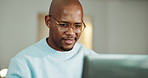 Black man, laptop and thinking in home with remote work, review and report for project management. Person, freelance writer and computer with reflection, decision or editing for creative proposal
