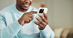 Phone, happy and hands of man in home with texting, chatting or social media on mobile app. Smile, technology and male person with cellphone for communication, networking or contact in apartment.