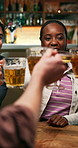 Reunion, cheers and friends in pub with beer, happy celebration and good time on weekend. Social gathering, smile or people with drinks toast, bonding party or get together in healthy relationship.