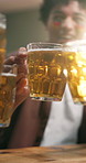 Man, beer and night with cheers in celebration for sport entertainment, event or social gathering. Happy, male person or group of fans with glasses, alcohol or toasting for winning or good game