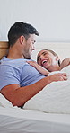 Couple, laugh and wake up in bed with conversation, bonding together or joke for connection on weekend. Happy, people relax and morning in house with relationship commitment, affection or funny story