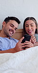 Couple, relax and phone in bed with coffee, browsing social media and laugh for funny online video. Morning, happy people dating and tech in home with drink, discussion and humor for relationship.