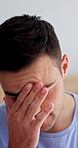 Stress, thinking or man with depression in bedroom for reflection, emotional and thought. Disappointed, migraine and person with anxiety, mental health or remember mistake with fatigue in home