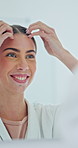 Mirror, haircare and happy woman in bathroom for beauty, grooming and preparation with morning routine. Reflection, hairstyle and person at home to check growth, smile or self care for getting ready