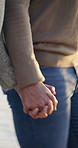 Walk, travel and couple holding hands on beach for romance, date and vacation or bonding together. Sunset, love and happy people with affection for weekend holiday, loyalty and anniversary support