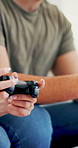Hands, couple and playing with controller, video game and tech for virtual sport, fun and web. Competition, man and woman with console for challenge, gamer and happy in home with entertainment