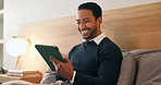 Businessman, relax or bed with tablet in hotel for business network, social media or schedule. Happy man, employee or traveler with smile on technology for internet, connection or browsing in bedroom