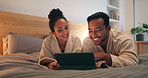 Night, couple and smile in bedroom with tablet, online entertainment and gaming together on weekend. Late, happy married people and relax in home with tech, conversation and digital app to play game.