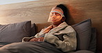 Red light, beauty and woman with mask for skincare, relax or wellness with collagen production. Health, cosmetic and female person on bed with LED phototherapy for dermatology treatment in home.