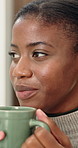 Coffee, thinking and black woman by window in home with memory, ideas or nostalgia in morning. Happy, cappuccino and female person with warm beverage for reflection, decision or choice in apartment.