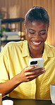 Woman, laugh and coffee at house with phone, social media and text message in lounge. Smile, beverage and African person in home with mobile app, browsing website and notification for comedy response