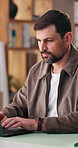 Typing, laptop and man in office for logistics, supply chain and shipping for delivery startup. Business, email and person on computer for inventory, distribution and online order for courier service