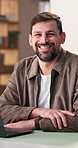 Happy, face and man in office for creative career, about us and pride for advertising agency. Smile, portrait and person with laptop for digital marketing, campaign and ambition for job opportunity
