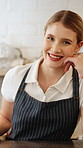 Counter, face and woman with smile for coffee shop, friendly service or hospitality in restaurant. Happy, cafeteria and portrait of person with confidence, pride and server for welcome, open or order