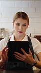 Tablet, counter and woman in coffee shop for online menu, inventory check and cafe website. Restaurant, hospitality and person on digital tech for stock checklist, supplier order and customer sales