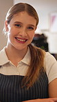 Happy, crossed arms and face of woman for coffee shop, friendly service or hospitality in restaurant. Smile, cafeteria and portrait of person with confidence, pride and server for welcome customer