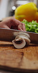 Hands, cooking and cut mushroom for healthy diet, vegan meal and organic nutrition in kitchen. Chopping board, woman and vegetables in home with natural ingredients, prepare food or culinary wellness