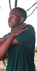 Warm up, fitness and thinking with black man in nature for health, reflection and workout start. Wellness, muscle stretching and runner or person outdoor for exercise commitment, self care and sports