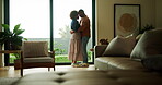 Couple, dance and love in lounge, house and bonding with partner on anniversary or smile on weekend. Black people, home and romance with spouse, rhythm and celebration for relationship milestone
