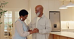 Love, couple and smile with dance in house for marriage celebration, holding hands and rhythm. Happy, mature black people and groove together in home for weekend break, relationship support and care