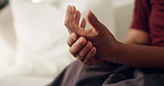 Hands, pain and woman at house with discomfort, inflammation and symptoms of osteoarthritis. Massage, mature person and living room with muscle stiffness, poor circulation issues and chronic numbness