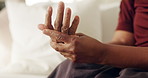 Hands, pain and woman in home with discomfort, inflammation and symptoms of osteoarthritis. Massage, mature person and house with muscle stiffness, poor circulation issues and chronic numbness