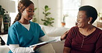Woman, caregiver and consulting on tablet in home for medical news, clear test results and support. Black people, mature patient and nurse with tech on sofa for healing progress, wellness and happy