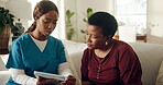Woman, nurse or consulting with tablet in home for test results, medical record or care plan. Black people, mature patient or caregiver with tech on sofa for health progress, online report or service
