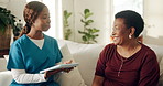 Woman, nurse and consultation on tablet in home for test results, medical report and good news. Black people, mature patient and caregiver with tech on sofa for healing progress, care plan or support