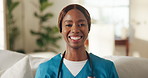 Smile, black woman and face of nurse in home with confidence for career in medical service. Happy, about us and portrait of female caregiver on sofa in living room with pride for community nursing.