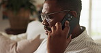 Phone call, home and man on sofa for talking, online conversation and chatting for remote work. Freelancer, house and African person on cellphone for contact, networking and update for communication