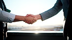 Real estate, people or handshake on balcony with greeting, intro or deal closed in sale agreement. Tech, flare or realtors with shaking hands, property exchange or success in investment negotiation.