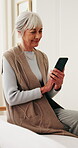 Senior woman, smile and texting with phone in bedroom, online and communication with contact on web. Typing, message and elderly person with mobile on bed, networking and internet connection in house