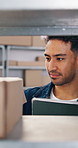 Logistics, man and box in warehouse with tablet, order picking or inventory management for ecommerce. Person, stock selection and dispatch in depot with tech, supply chain or verification for export.
