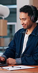 Man, logistics and headphones in warehouse with laptop, research and streaming music for delivery. Smile, person and dancing at small business with pc, listening to podcast and ecommerce distribution