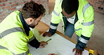 Architecture, team and meeting with blueprint for planning, design update or collaboration. Discussion, men and floorplan at worksite for engineering, explain infrastructure or maintenance compliance