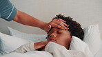 Forehead, hand and mom with sick child in bedroom, health check and monitor body temperature in home. Childcare, parent and person with concern for black kid, help and boy with flu symptoms in house