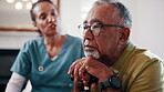 Thinking, caregiver and senior man with cane, sad and ignore advice at consultation or visit. Nurse, assisted living and old person with depression, dementia or memory loss in retirement home