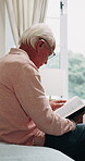 Senior man, reading and bible in bedroom, faith and worship with holy scripture or spiritual belief. Praise, God and pensioner with book for Christianity, knowledge and Jesus Christ guidance in house