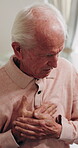 Chest pain, old man and thinking in home with massage, hypertension and symptom of cardiac arrest. Senior person, retirement and worry in house with heartburn, chronic illness or cardiovascular issue