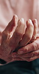 Senior person, hurt and hands with sprain, muscle tension and uncomfortable with strain and closeup. Retirement, discomfort and pensioner with arthritis symptoms, joint pain and stretching fingers