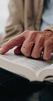 Old person, home and hands with bible, reading and worship with holy scripture and spiritual belief. Praise, God and pensioner with book for Christianity, knowledge and Jesus Christ guidance in house